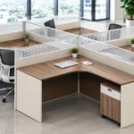 Commercial four-person office workstation with wood-effect desks and partitions