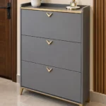 Modern three-tier grey shoe cabinet with gold accents