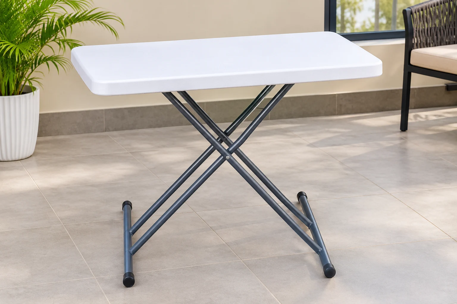 White rectangular folding table with dark metal cross-braced legs for office meetings and events.