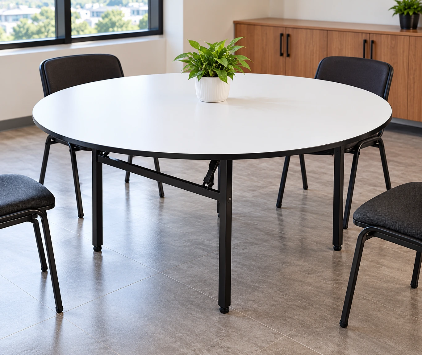 White round folding banquet table with black metal legs for conferences and corporate events in Kenya.