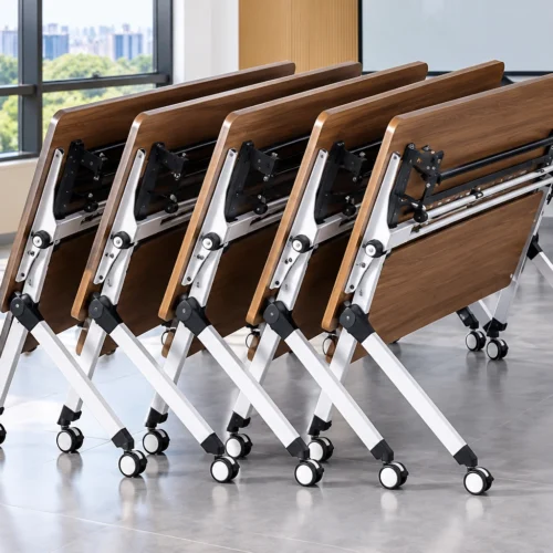 Mobile flip-top folding training tables with caster wheels and wood-look tops nested together in a modern office.